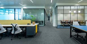 A working area and meeting rooms in a Serviced Office